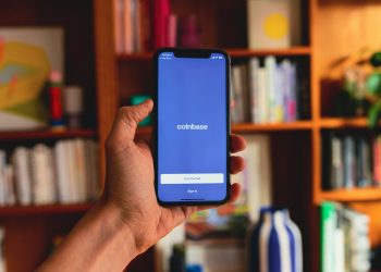 Coinbase Faces Analyst Downgrade as Crypto Volatility Weighs on Stock Valuation cover