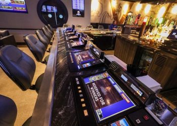 Tabletop games line the bar at Flowing Tide Pub in northwest Las Vegas on Wednesday, Feb. 22, 2023. (Jeff Scheid/The Nevada Independent)