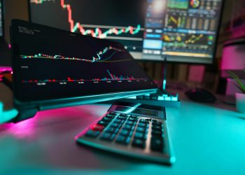 A desk with a keyboard and a monitor