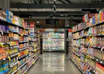 grocery store aisle with stocked shelves