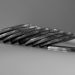 a stack of silver coins sitting on top of a table