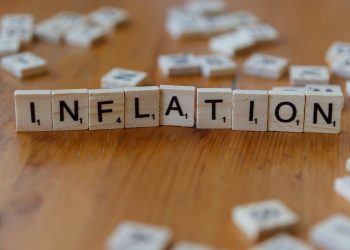 Inflation is spelled out using scrabble tiles.