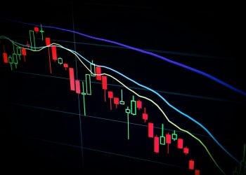 stock market candlestick chart on dark screen